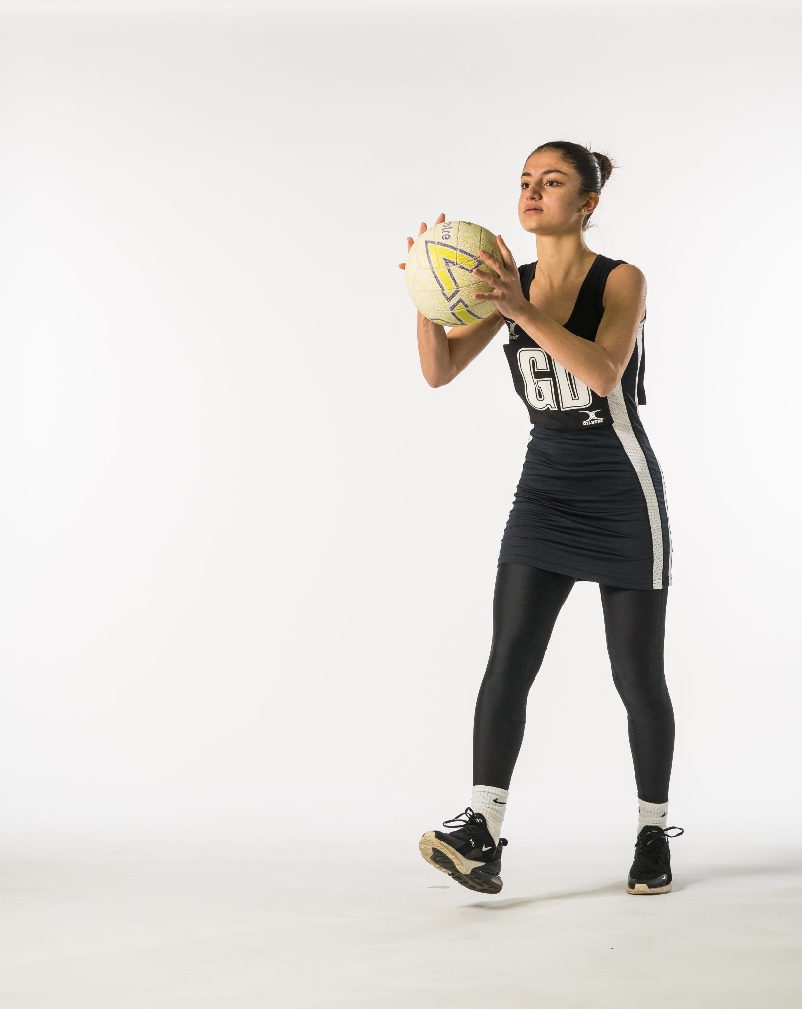 student holding a netball